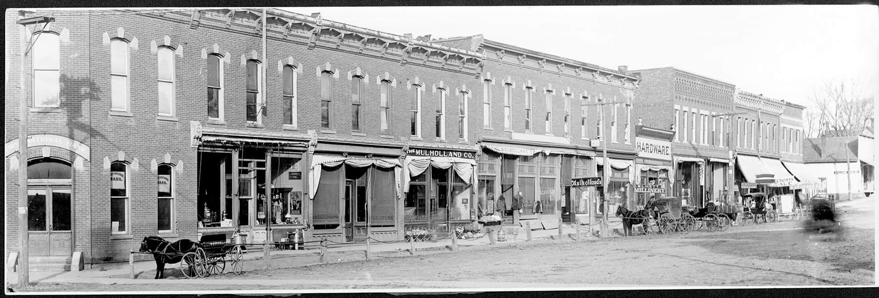 Main Street Malvern Iowa circa 1875 — The Mulholland Co. storefront with horse-drawn carriages